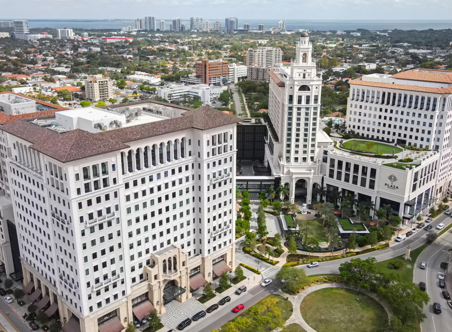Aerial view of The Plaza Coral Gables and surrounding downtown buildings.