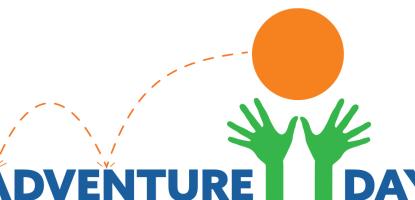 Young girl smiling and riding rocket swing in a park