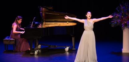 Operatic singer and pianist on stage performing