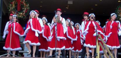 High school students on stage performing Christmas carols