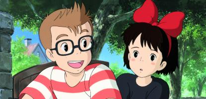 Frame of from animated movie, a boy smiles and talks to a girl 