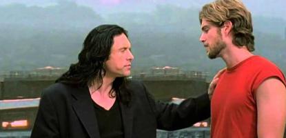 From film The Room, A man puts his hand on another man's shoulder on a rooftop.