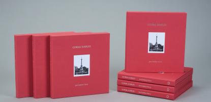 Red "Coral Gables" books laid out in a display
