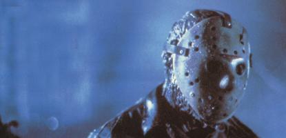 Jason stands in the woods on a dark misty night