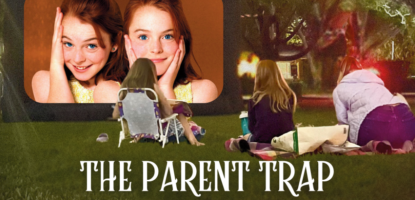 Foreground people watch a screen outside. The screen has two girls from The Parent Trap movie