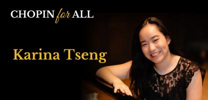 Karina Tseng smiling in a black dress with a black background behind her