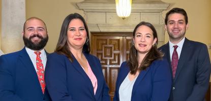City Attorneys in suits pose together inside Coral Gables City Hall