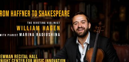 Hagen in suit smiles and holds violin 