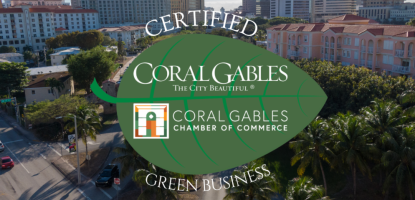 Beautiful drone shot of the city with Green Business Leaf logo in the front