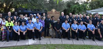 Police posing in evening daylight after national night event