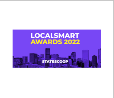 Purple LocalSmart awards with buildings silhouetted in the background