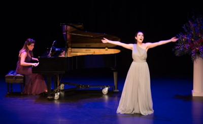 Operatic singer and pianist on stage performing