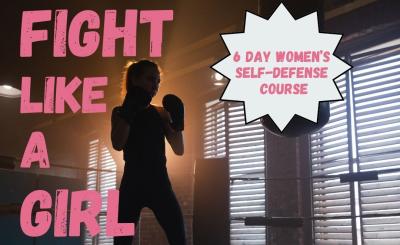 A silhouette of a woman boxing in the gym.