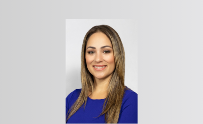 Headshot of Commissioner Castro smiling in blue, business attire