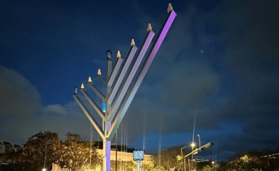 A menorah is lit in front of City Hall
