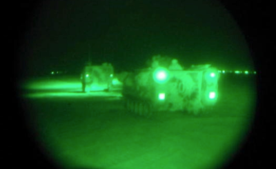 Iris lens, green night vision view of soldiers patrolling
