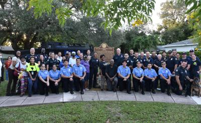 Police posing in evening daylight after national night event