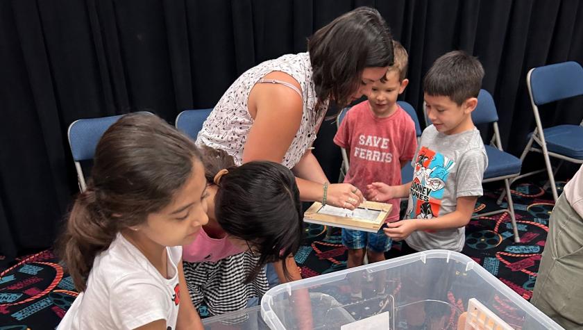 Krystal Rodriguez helps children with their art